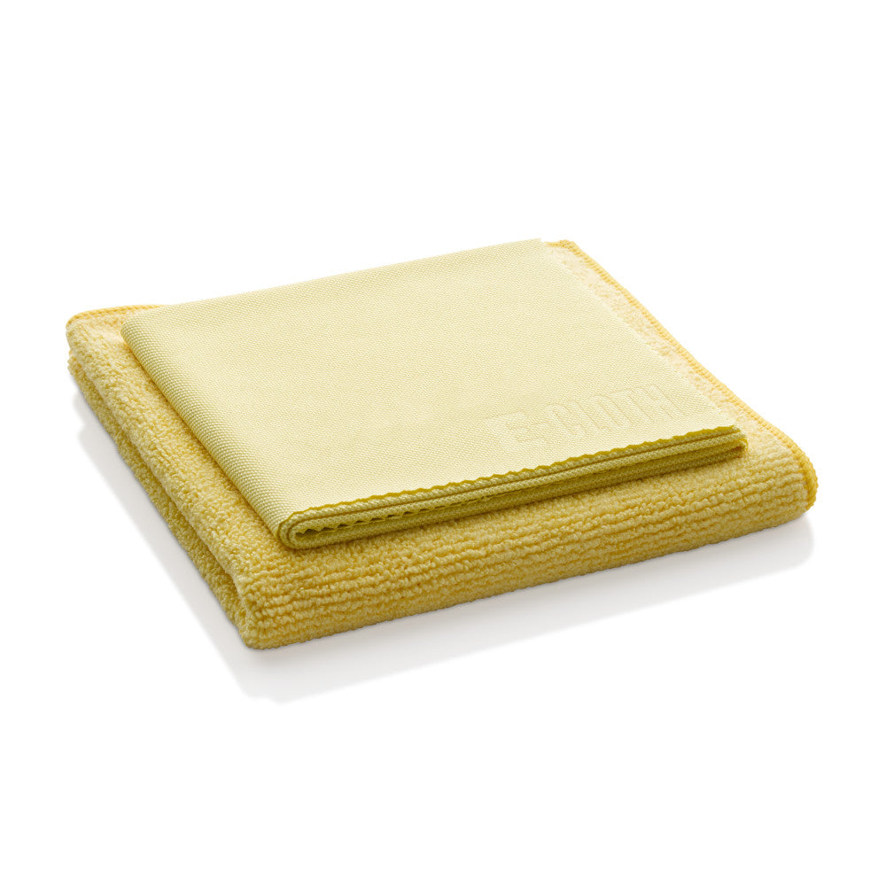 The Bathroom Cleaning Kit by E-Cloth is shown here, with a folded yellow microfiber cloth stacked neatly on top of another, both designed for effective bathroom cleaning against a white background.
