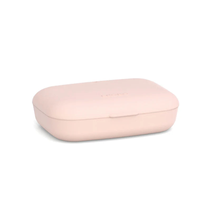 A closed, light pink rectangular Bamboo Travel Soap Box from Ekobo, with rounded edges, is placed on a white background.