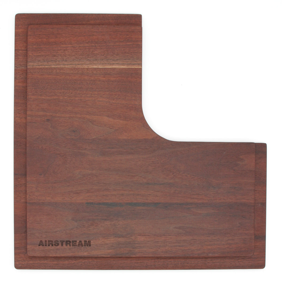 Airstream Custom Sink Cutting Boards for Interstate 24GT/GTX are L-shaped wooden boards with a groove near the edge and “AIRSTREAM” engraved in the lower left corner, designed to fit seamlessly over your Airstream sink for easy food prep.