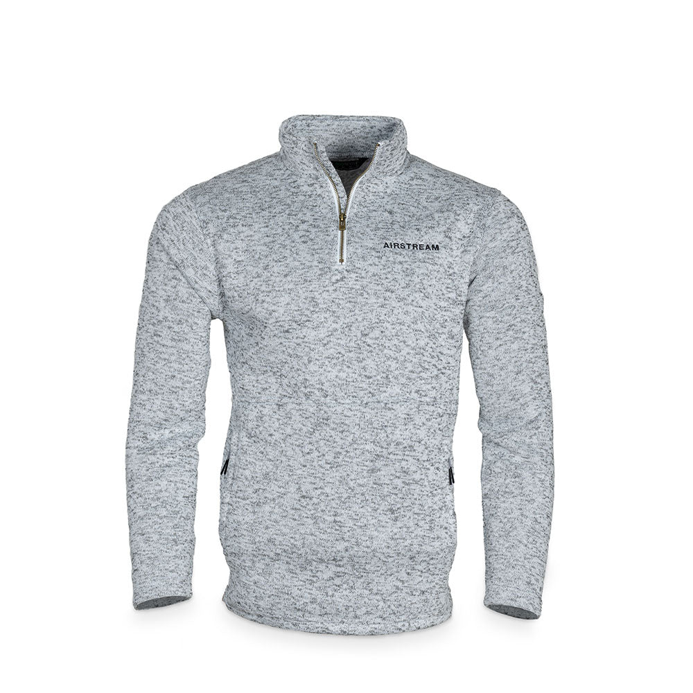 The Airstream Alpine Fleece Unisex 1/4 Zip Pullover is a gray speckled Eco-Revive pullover featuring long sleeves, a stand-up collar, and “AIRSTREAM” embroidered on the left chest. Displayed on a white background, this quarter zip is part of the Airstream Alpine Fleece collection.