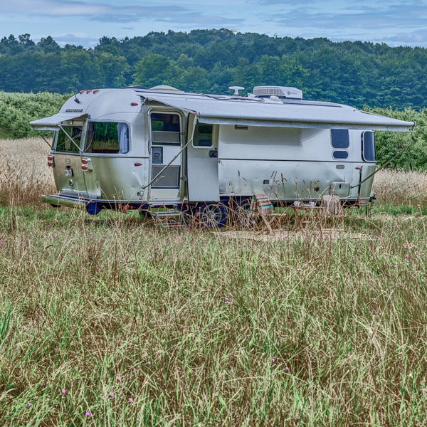 Airstream Trailer in Grassy Field