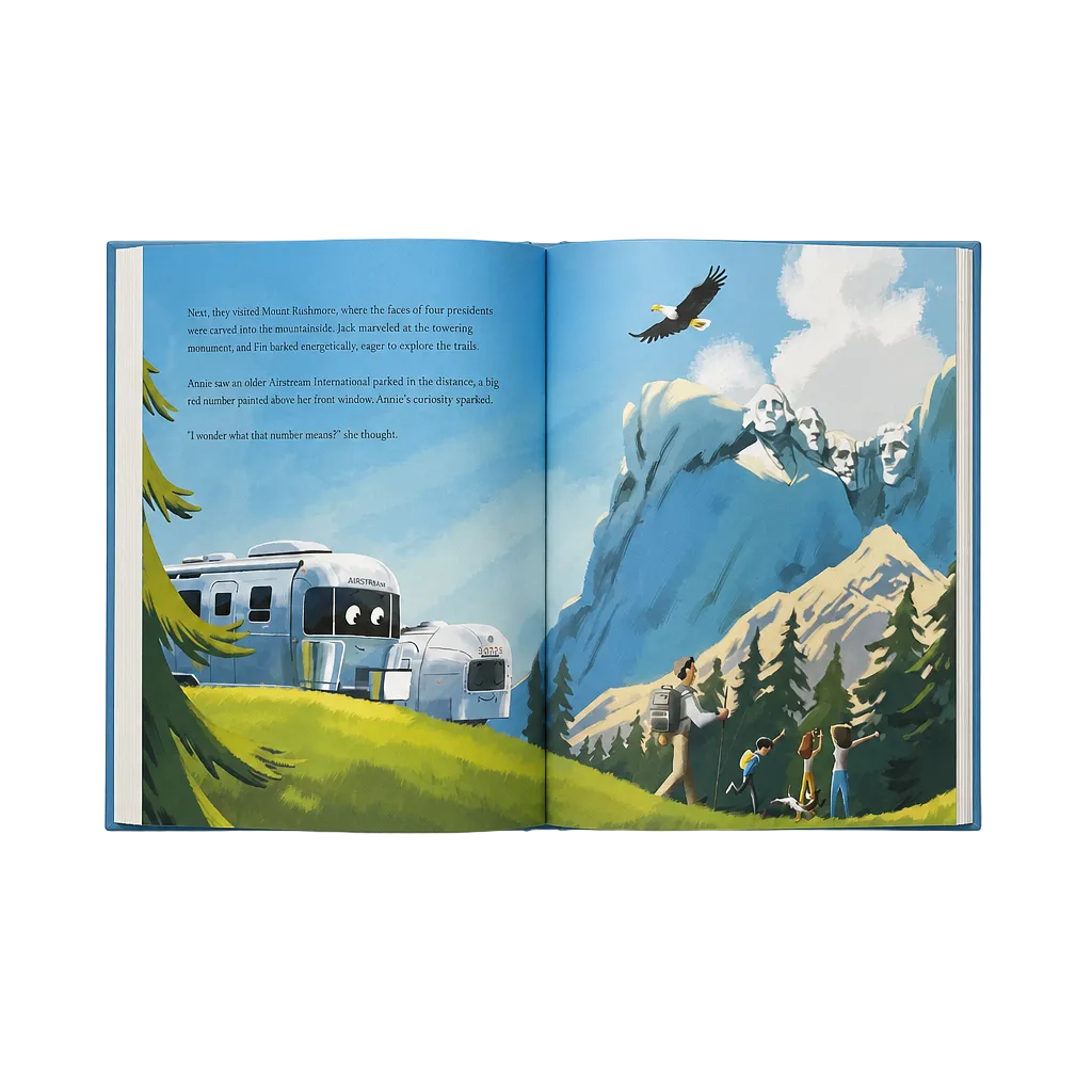 Open book showing a scenic illustration with mountains, a trailer, and people.