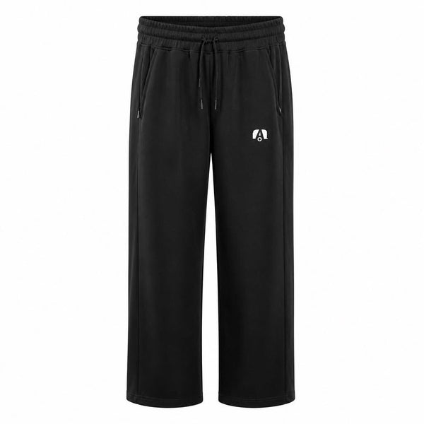 Black wide-leg sweatpants with an elastic drawstring waistband, side pockets, and a small white stylized 'A' logo on the left thigh, shown against a plain white background.