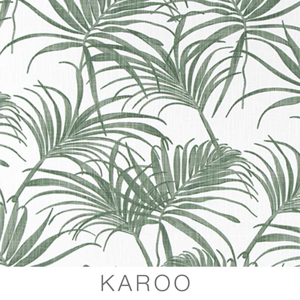 Featuring a green palm leaf pattern on a white background with “KAROO” in bold, gray uppercase letters below, these Airstream Printed Custom Curtains for Caravel Travel Trailers are perfect for adding a stylish touch to your travel trailer or as custom replacement curtains.