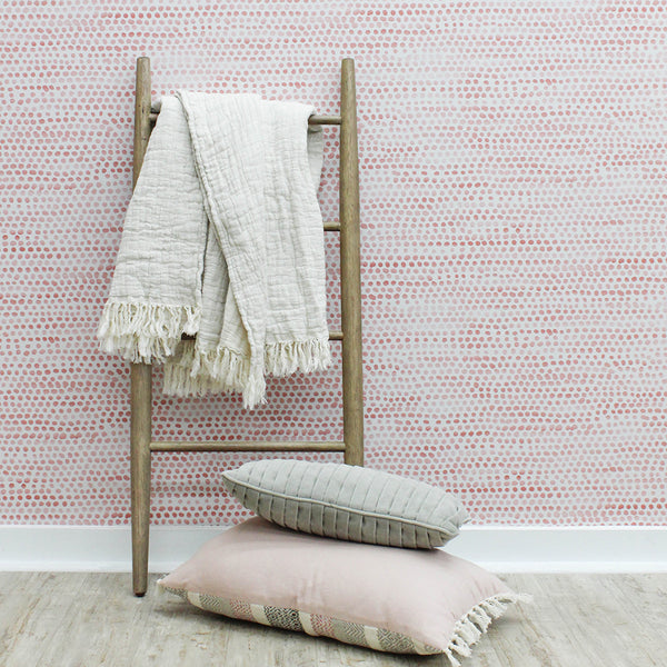Moire Dots Coral Tempaper blanket on ladder