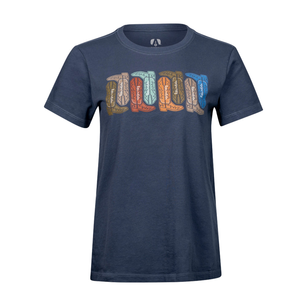 The Airstream Western Wander Women’s T-Shirt in navy blue features a vibrant pattern of upright feathers across the chest, each in a unique shade, creating a bold Western-inspired graphic tee—perfect for women seeking the ultimate road trip shirt.