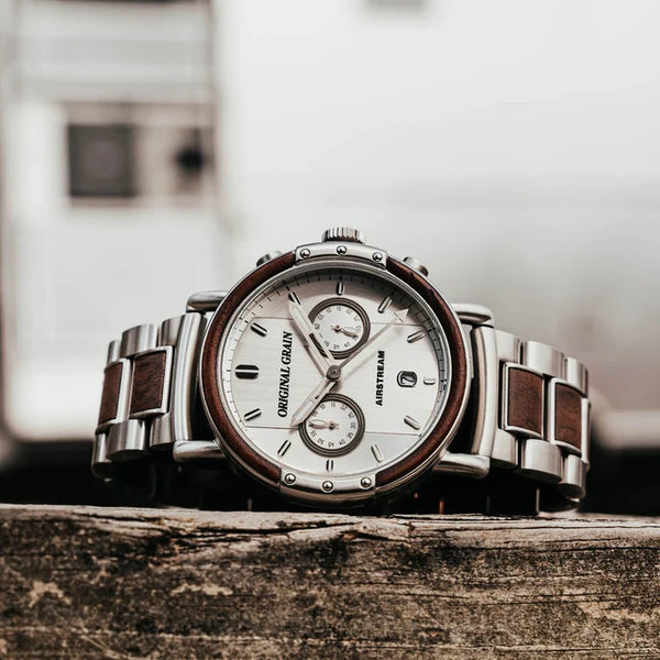Luxury watch with wooden accents on a wooden surface