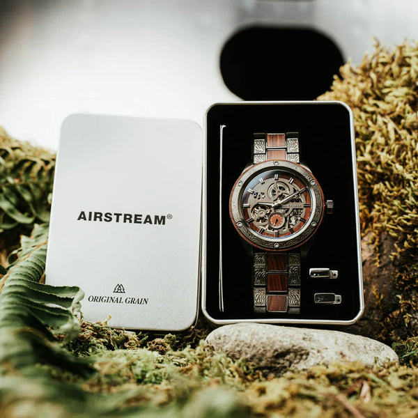 Watch in a 'Airstream' branded box on a natural background
