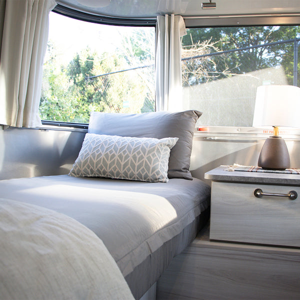 One of the twin beds in an Airstream Travel Trailer with Beddy's zip sheets and pillows
