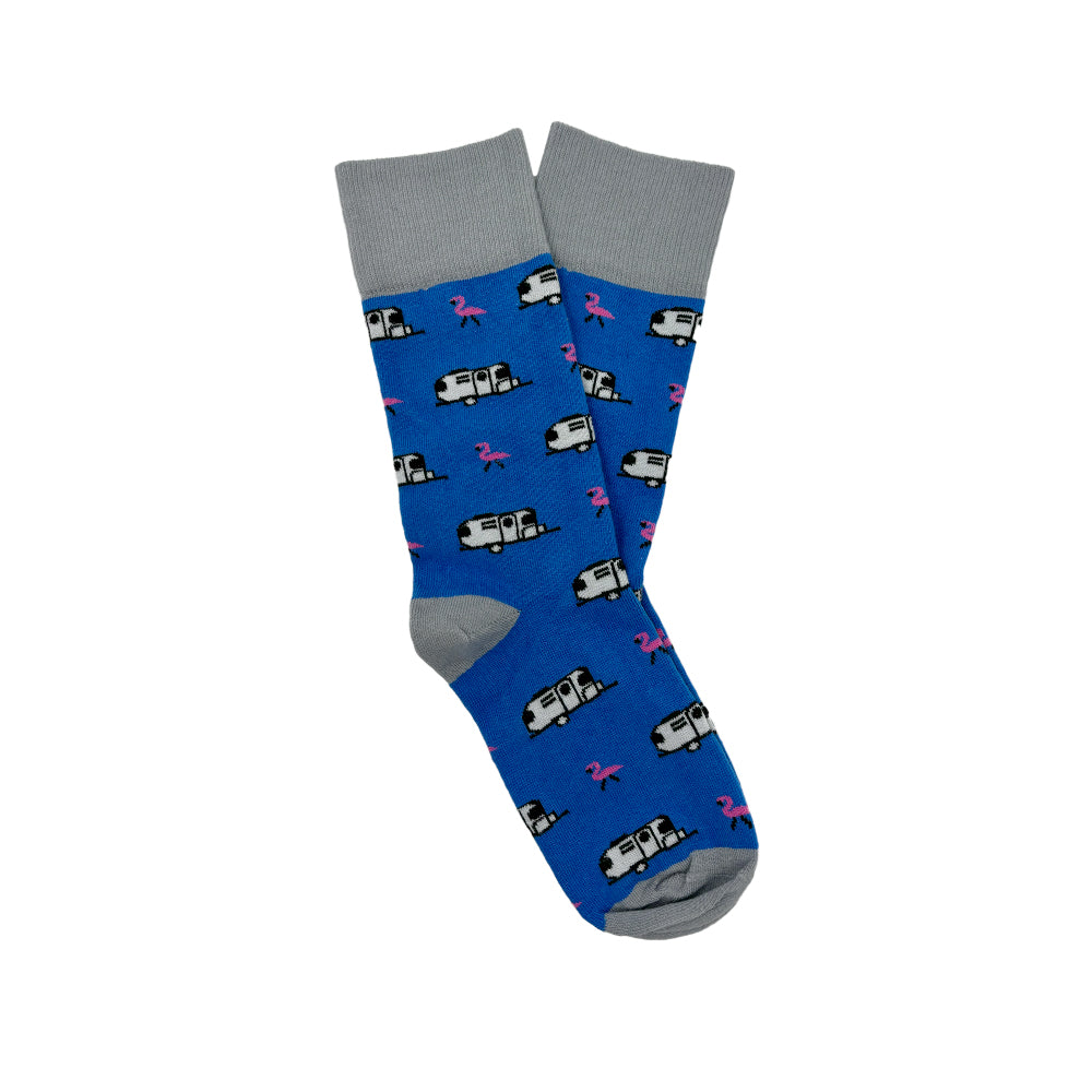 Airstream Flamingo Trailer Socks: Blue socks accented with gray cuffs, heels, and toes, adorned with a repeating motif of white travel trailers and playful pink flamingos—a whimsical update to classic Airstream style.