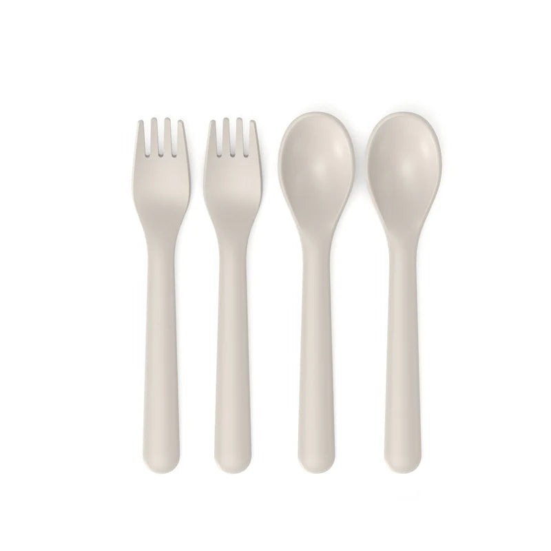 The Bamboo Reusable Cutlery Set Duos, Set of 2 by Ekobo features four beige utensils displayed on a white background—two forks on the left and two spoons on the right—each crafted from a bamboo eco-composite with rounded handles and a sleek, modern look. These BPA-free, reusable cutlery pieces are both environmentally friendly and stylish.