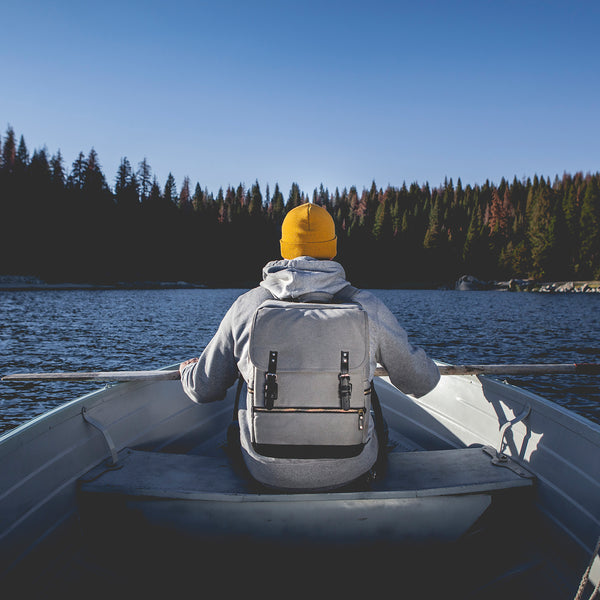 picnic time bar backpack man in boat