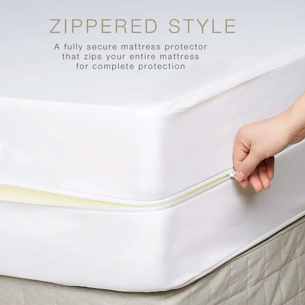 A hand zips an Airstream Custom Encasement for Bambi Travel Trailers over a mattress, demonstrating the zippered full-coverage style. The text highlights it as a secure, waterproof mattress cover that completely encases the mattress to offer reliable bed bug protection.