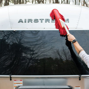 Shell of an Airstream being cleaned with a California Car Duster