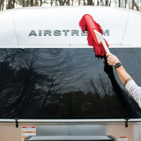 Shell of an Airstream being cleaned with a California Car Duster
