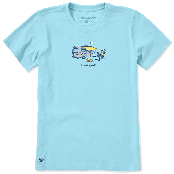 A light blue short-sleeve crewneck t-shirt featuring a small camping-themed graphic on the chest with a camper van, dog, and the text 'life is good!'.