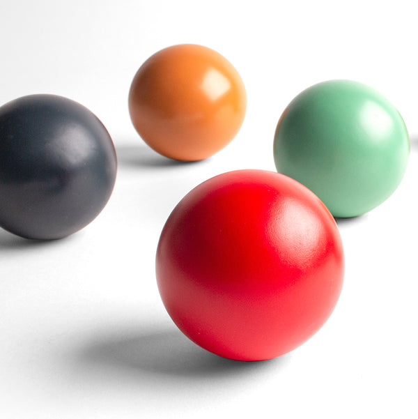 Up close of multiple colored croquet balls