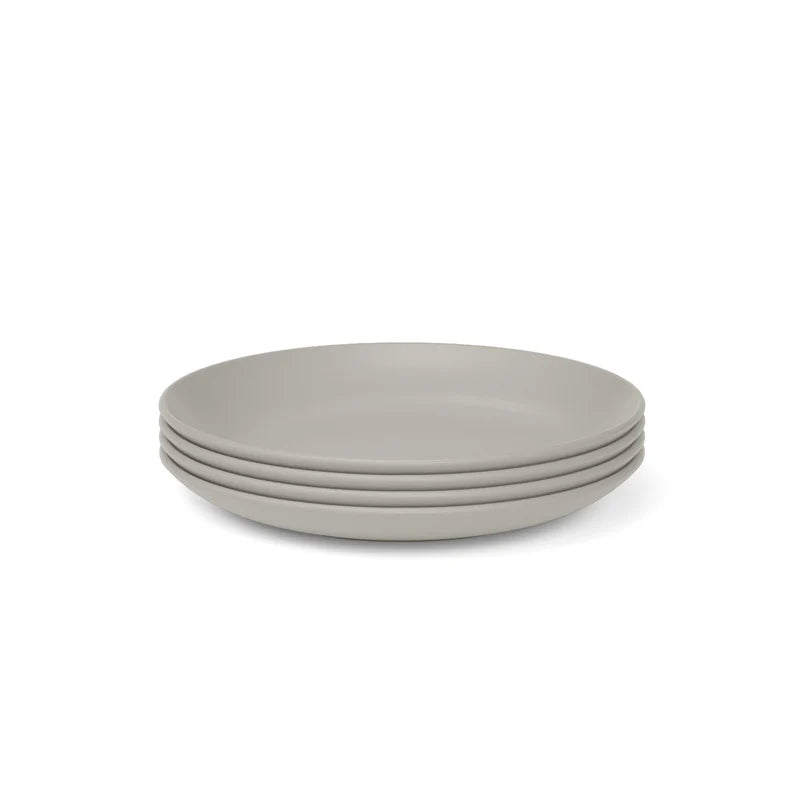 A set of four light gray bamboo eco-composite plates from the Bamboo Round Plate Set of 4 by Ekobo is displayed against a white background.