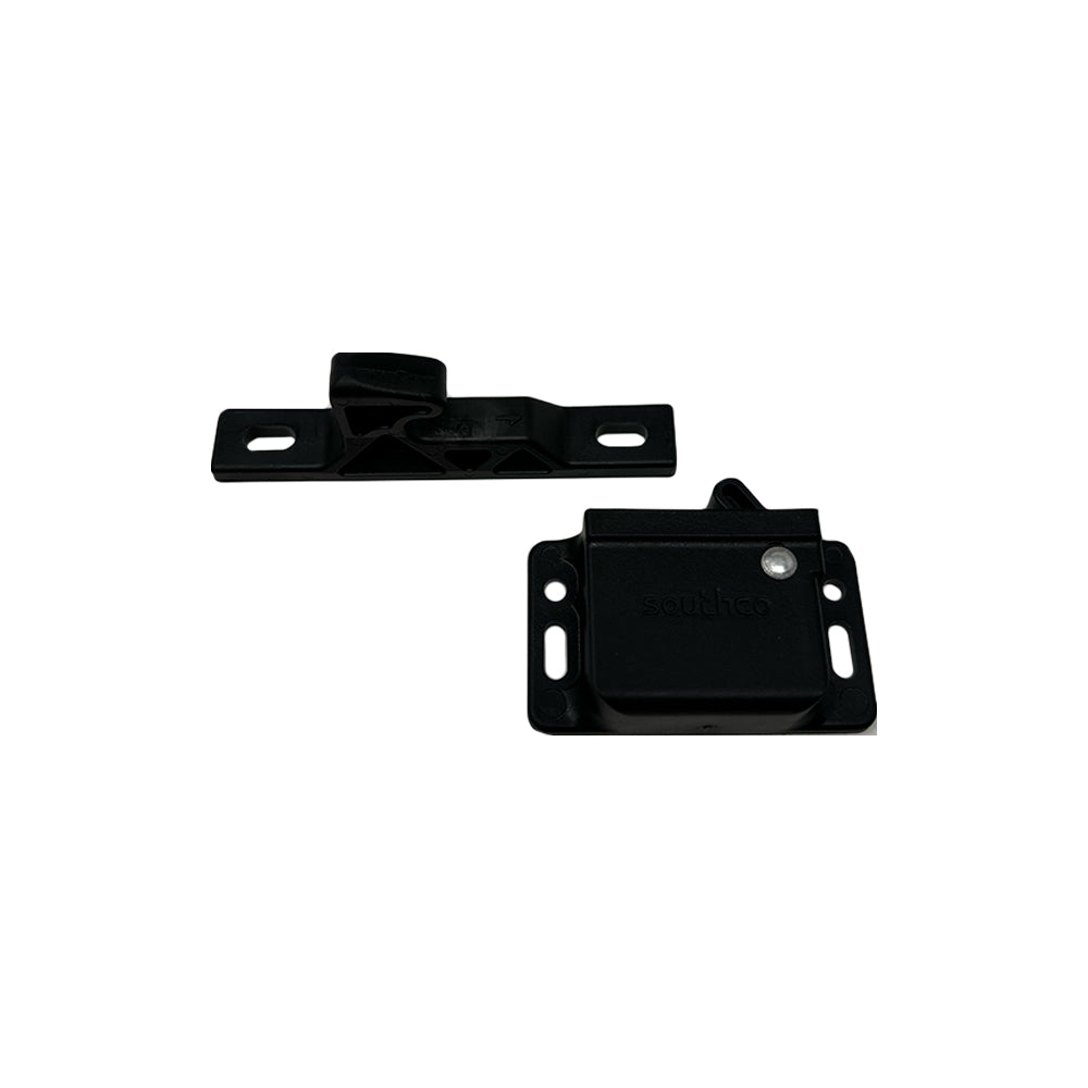 Two black metal latch components—one a rectangular catch, the other a mounting plate with two screw holes on each side—are shown against a white background. The Airstream Catch Grabber Door Latch (Part #381228, 381228-02) is ideal for securing panels or doors in your vintage trailer project, providing reliable performance as an Airstream cabinet latch.