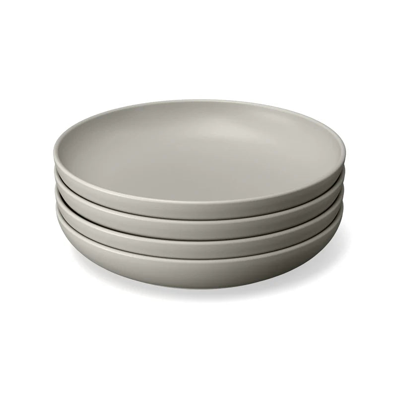 A set of four round, light gray plates made from BPA-free bamboo eco-composite, the Bamboo Round Plate Set of 4 by Ekobo, displayed on a white background.