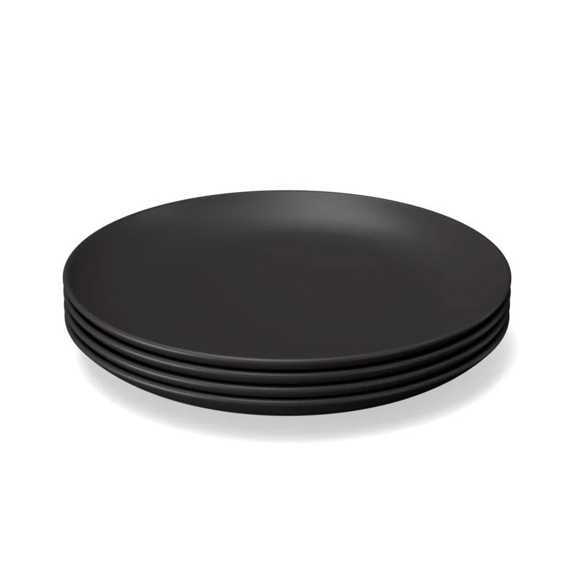 The Bamboo Round Plate Set of 4 by Ekobo features four round, matte black plates crafted from BPA-free bamboo eco-composite, displayed against a white background.