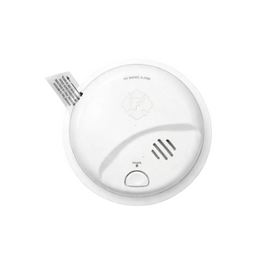 White smoke alarm on a light gray background
