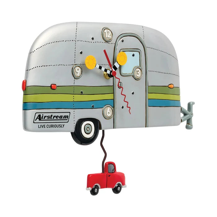 Add a touch of adventure to your space with the Airstream Wall Clock—a vibrant camper-shaped timepiece adorned with colorful stripes and a swinging red toy truck beneath. The clock face is artfully set within the trailer’s door and window, making this wall clock an ideal wanderlust gift or perfect decor for anyone inspired by travel.
