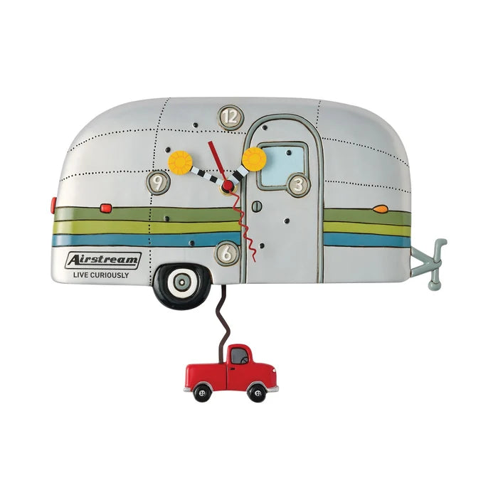 The Airstream Wall Clock is a whimsical, silver trailer-shaped wall clock featuring bold green and blue stripes and the phrase “Live Curiously” on its side. It includes a playful pickup truck pendulum and bold hands and numbers—making it an ideal choice for adventure decor enthusiasts who appreciate unique timepieces.