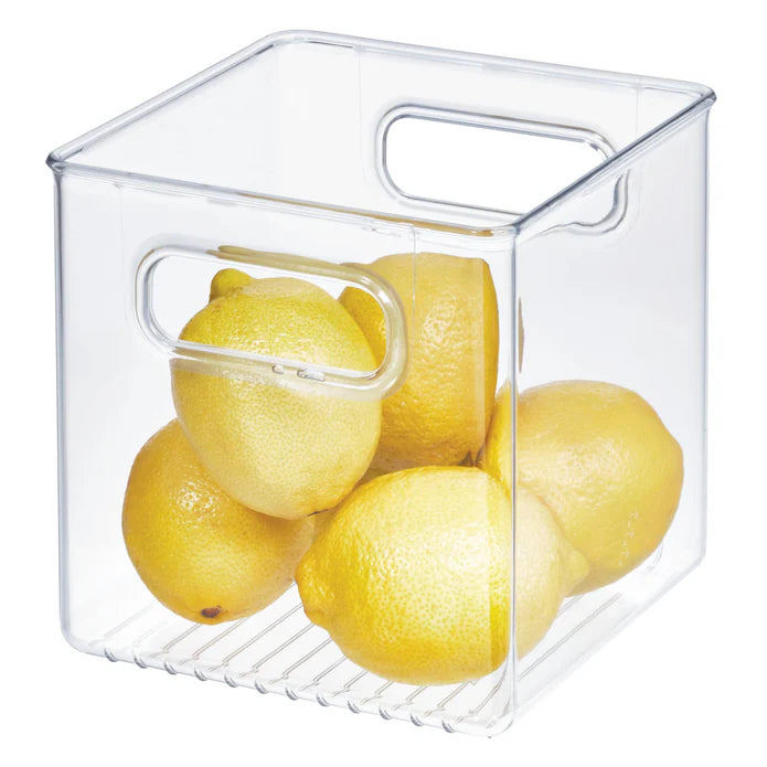 A Cube Storage Bin, 6 x 6 x 6, made of clear BPA-free plastic and featuring handles, holds five yellow lemons—making it perfect for Airstream organization.
