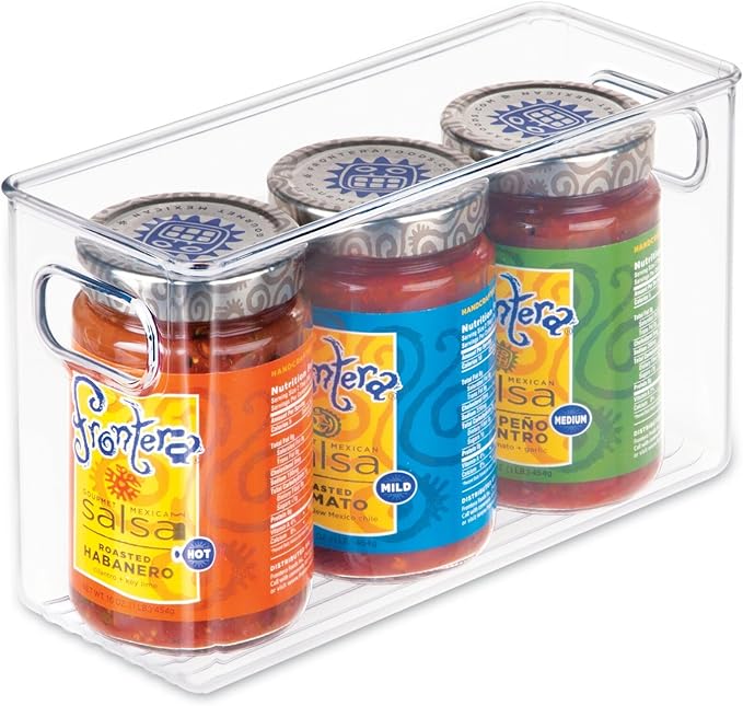 The Airstream Kitchen + Pantry Storage Bundle features three jars of Frontera salsa (hot, mild, and medium) neatly arranged in a clear plastic storage bin with convenient side handles. Ideal for pantry or Airstream kitchen organization, this bundle keeps your favorite salsas easily accessible and tidy. Each jar is topped with a silver lid and sports a colorful label for an eye-catching addition to your storage solutions.