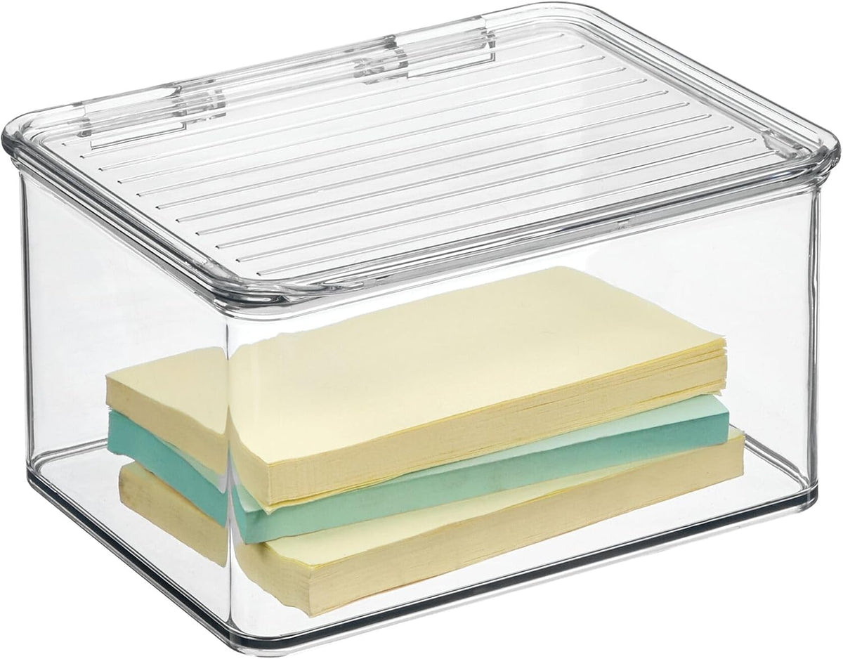 Clear plastic storage box with a slotted lid, shown on a white background with two stacks of sticky notes inside.