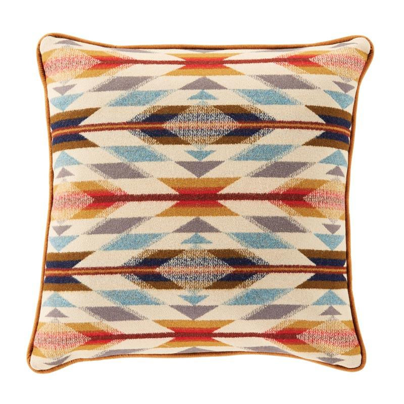 Enhance your space with the Decor Pillows by Pendleton Wool Mills—square decorative pillows showcasing a vibrant geometric pattern in blue, orange, yellow, brown, and red hues, finished with elegant brown piping for a luxurious touch to your home decor.