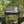 Portable camping stove with pots and pans on a stand in a forest setting