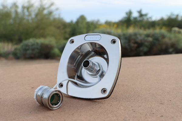 Water Inlet on a sandy surface with desert plants in the background