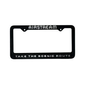 Black license plate frame with 'Airstream' and 'Take the Scenic Route' text on a white background