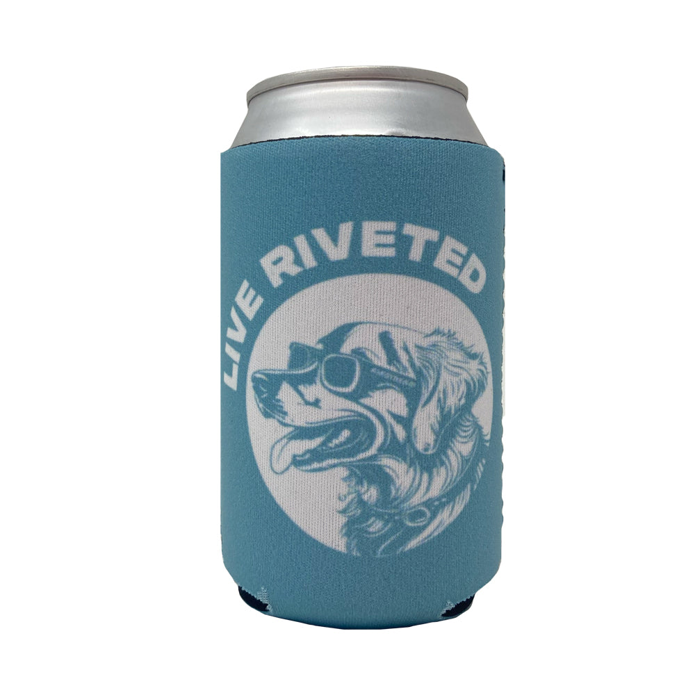 Keep your drink cool on your next adventure with the playful Airstream Dog with Sunglasses Can Cooler—a light blue can cooler featuring an illustration of a dog sporting sunglasses and the phrase “LIVE RIVETED” above the image.