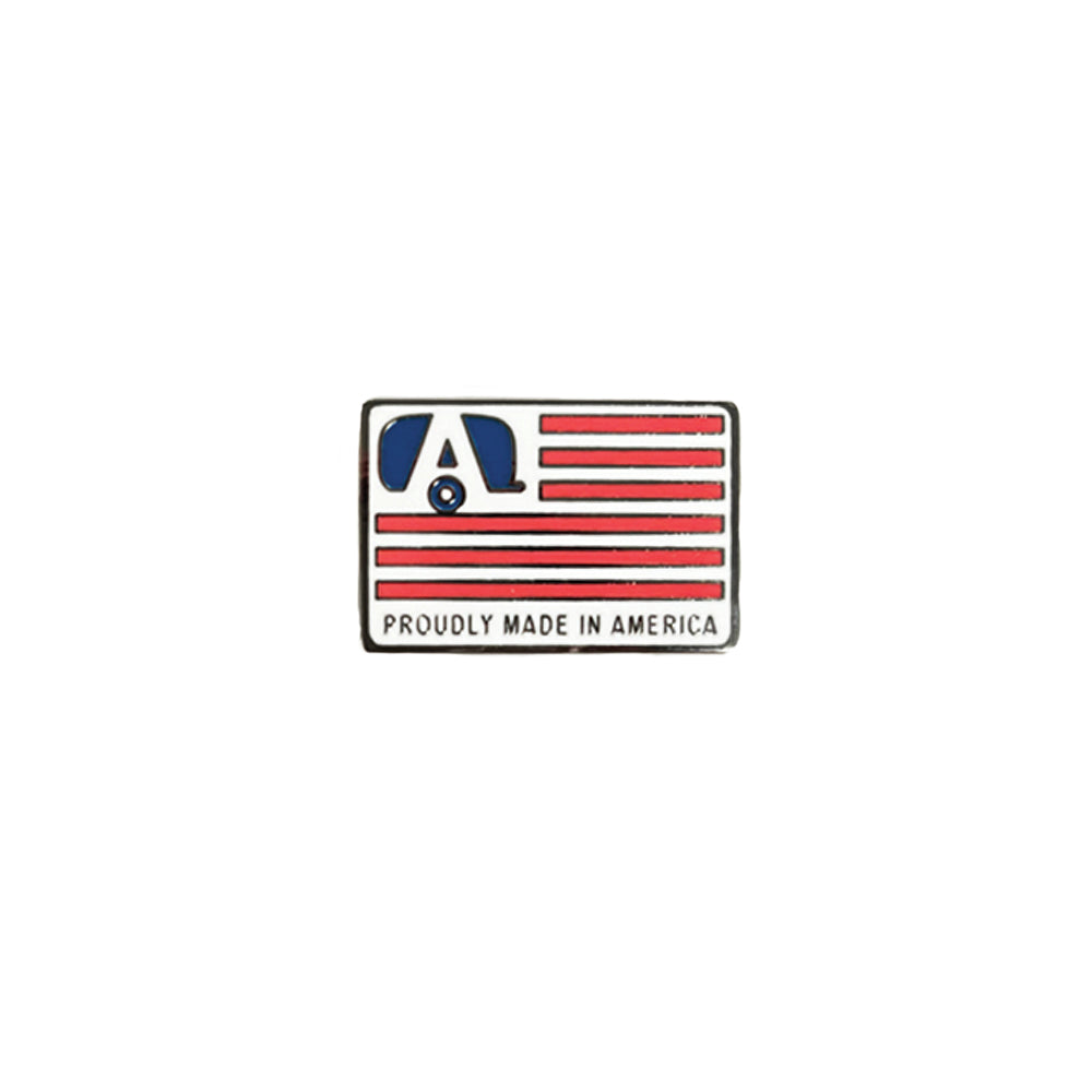 Show your “Made in America” pride with the Airstream Made in America Flag Pin—a rectangular pin featuring red stripes, a blue “A” in the upper left corner, and the text “PROUDLY MADE IN AMERICA” at the bottom.