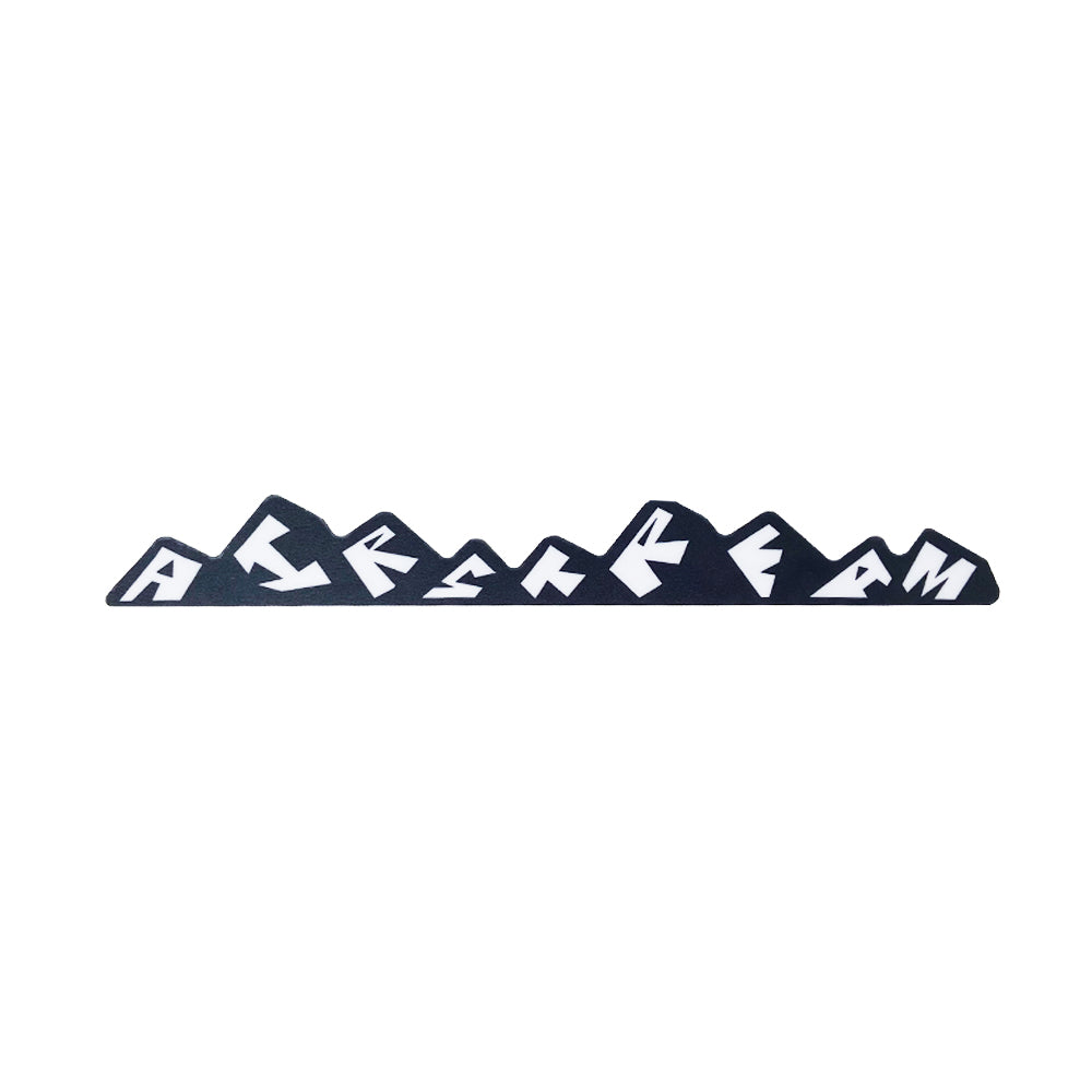 Decorate your travel rig with the Airstream Mountains Logo Vinyl Removable Sticker, featuring a sleek black silhouette of a mountain range with abstract white shapes inside each peak that resemble stylized block letters—a perfect personalized decal for your Airstream.