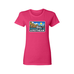 a pink women's t-shirt with a mountain and tree abstract design featuring the Airstream logo and an Airstream Travel Trailer