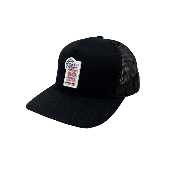 A black trucker hat with a patch that says USA Roaming Free Airstream Live Riveted