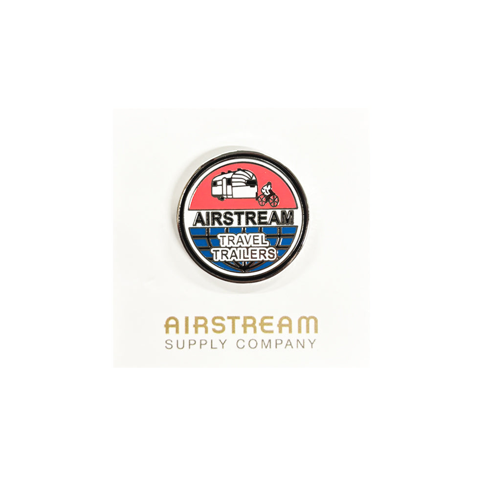 Introducing the Airstream Vintage Bicycle Towing Trailer Pin—a charming round vintage pin showcasing a retro Airstream trailer, an adorable dog, and blue and white lettering that reads “AIRSTREAM TRAVEL TRAILERS.” Below, “AIRSTREAM SUPPLY COMPANY” is printed on a crisp white background. This nostalgic accessory is perfect for any fan of Airstream or bicycle towing trailers!.