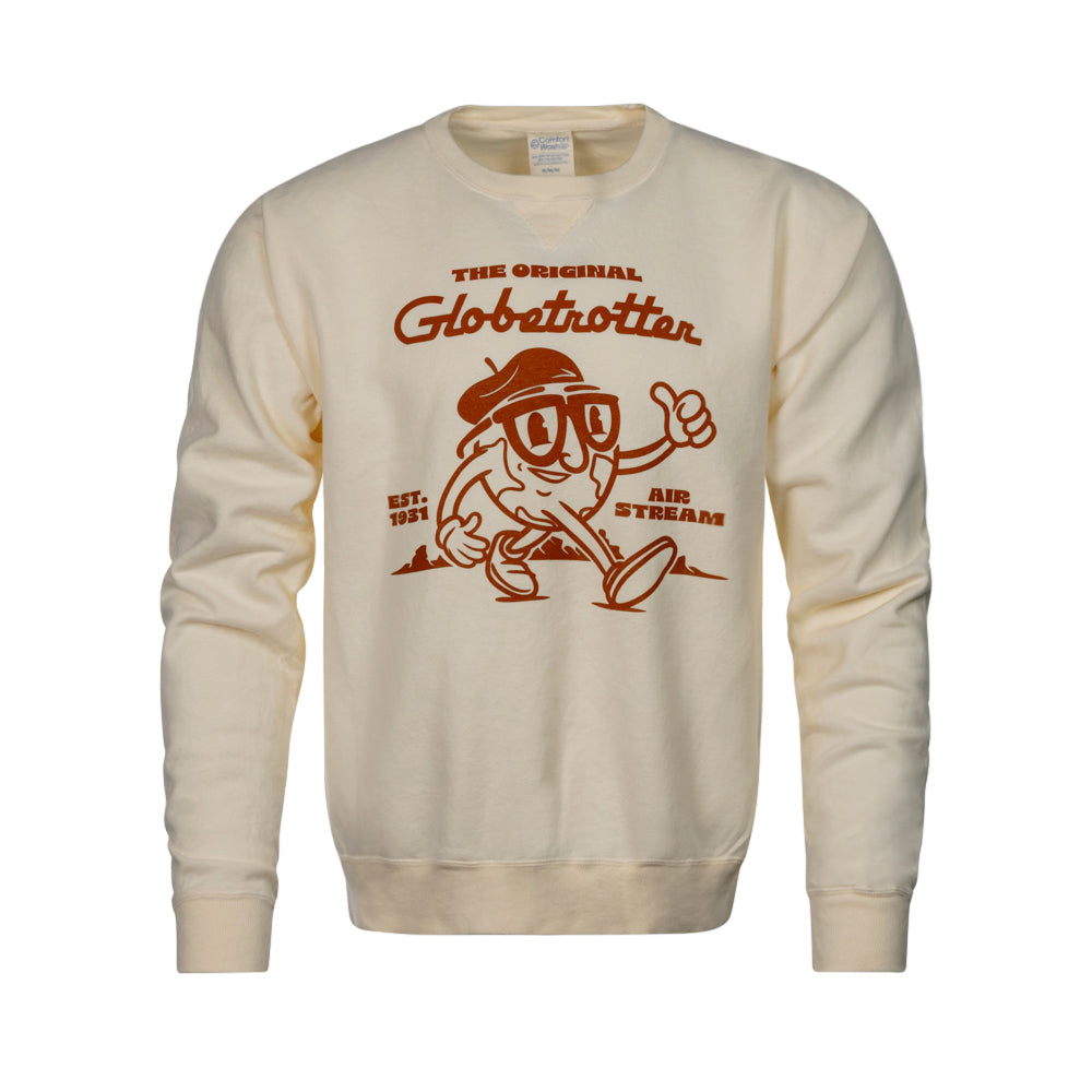 The Airstream the Original Globetrotter Sweatshirt is a cream-colored sweatshirt featuring a playful cartoon character with glasses and a hat, alongside the text “The Original Globetrotter, Est. 1951, and Airstream.” With its brown-printed illustration, this stylish sweatshirt is perfect for travel apparel enthusiasts.
