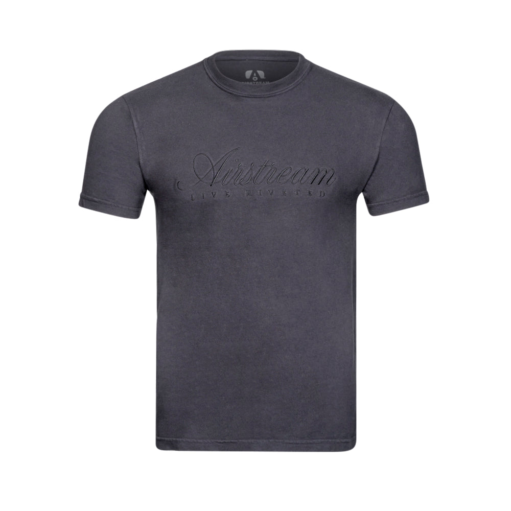 The Airstream Signature Series T-Shirt is a classic short-sleeved tee in dark gray, featuring elegant cursive embroidery of “Airstream” and the phrase “Live Riveted” on the front.
