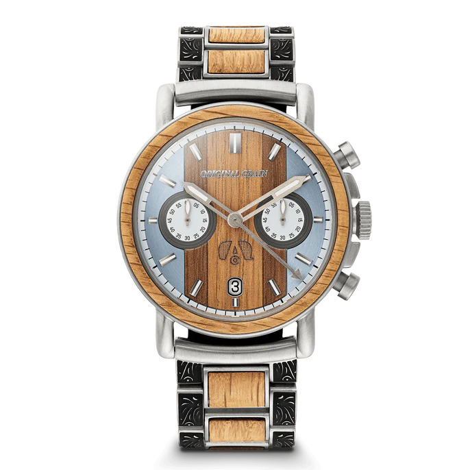 A luxury chronograph watch by Originally Chari, featuring a round wood-grain dial, a light blue sub-dial face, and a two-tone stainless steel and wood link bracelet on a white background.