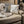 Tommy Bahama pillow and blanket on a leather couch