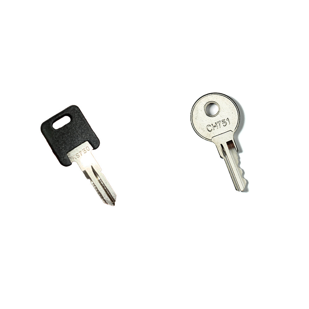 The Airstream Cut Key Bundle for Basecamp Travel Trailers includes two pre-cut keys on a white background: one with a black rectangular plastic head and the other with a round silver head marked CH751—perfect as spare keys for your Airstream Basecamp.