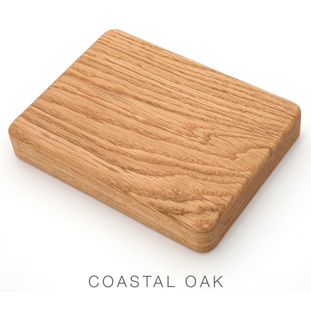 A rectangular wooden board with visible grain, labeled “Airstream Wood Dinette Table Upgrade for Quiksilver Travel Trailers,” rests on a white surface—perfect as a premium wood tabletop or solid dinette table.