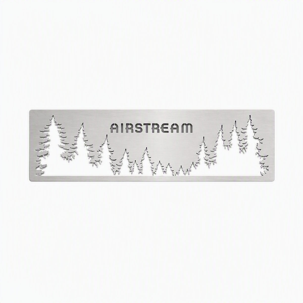 The Airstream Forest Scene Screen Door Guard is a custom-made silver metal plate featuring the word “AIRSTREAM” cut out, with surrounding cut-out silhouettes of pine trees, designed as an accent for Airstream screen doors and set against a white background.