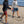People Playing Elakai Horseshoes Game On A Beach