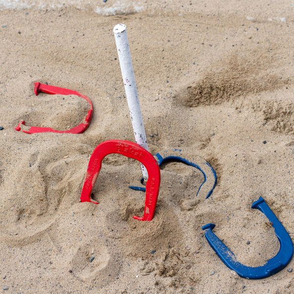 Red And Blue Elakai Horseshoes Game In The Sand